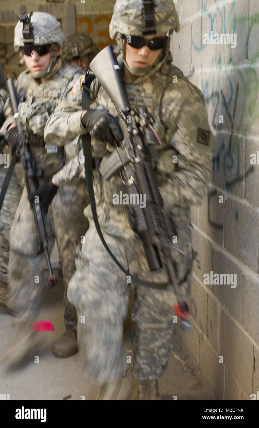 Army engineers sweep and clear a building during exercise Dagger Strike