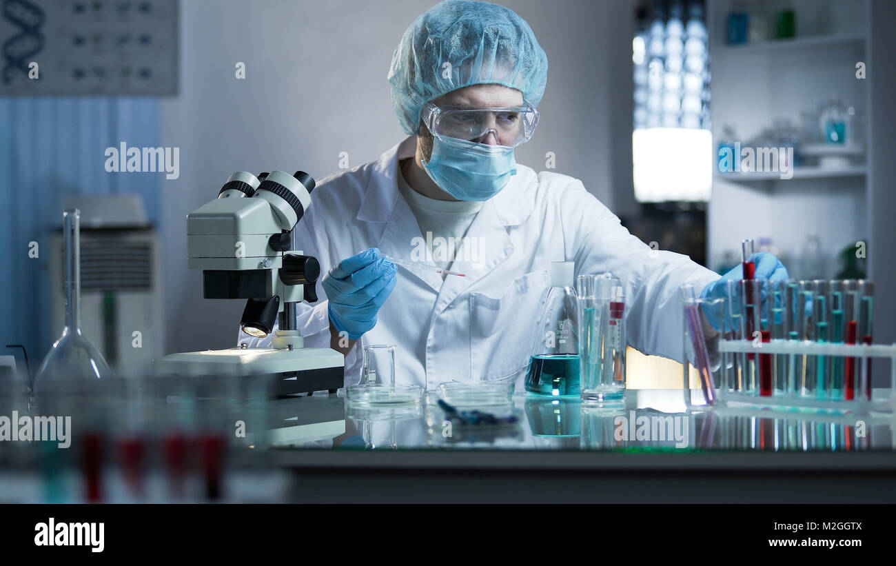 Lab scientist taking blood sample to study dna branches for cloning process, stock video Stock