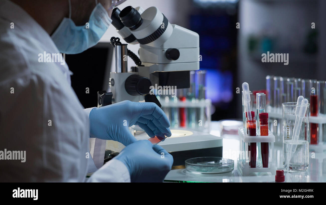 Medical worker making blood test for detection of antibodies and