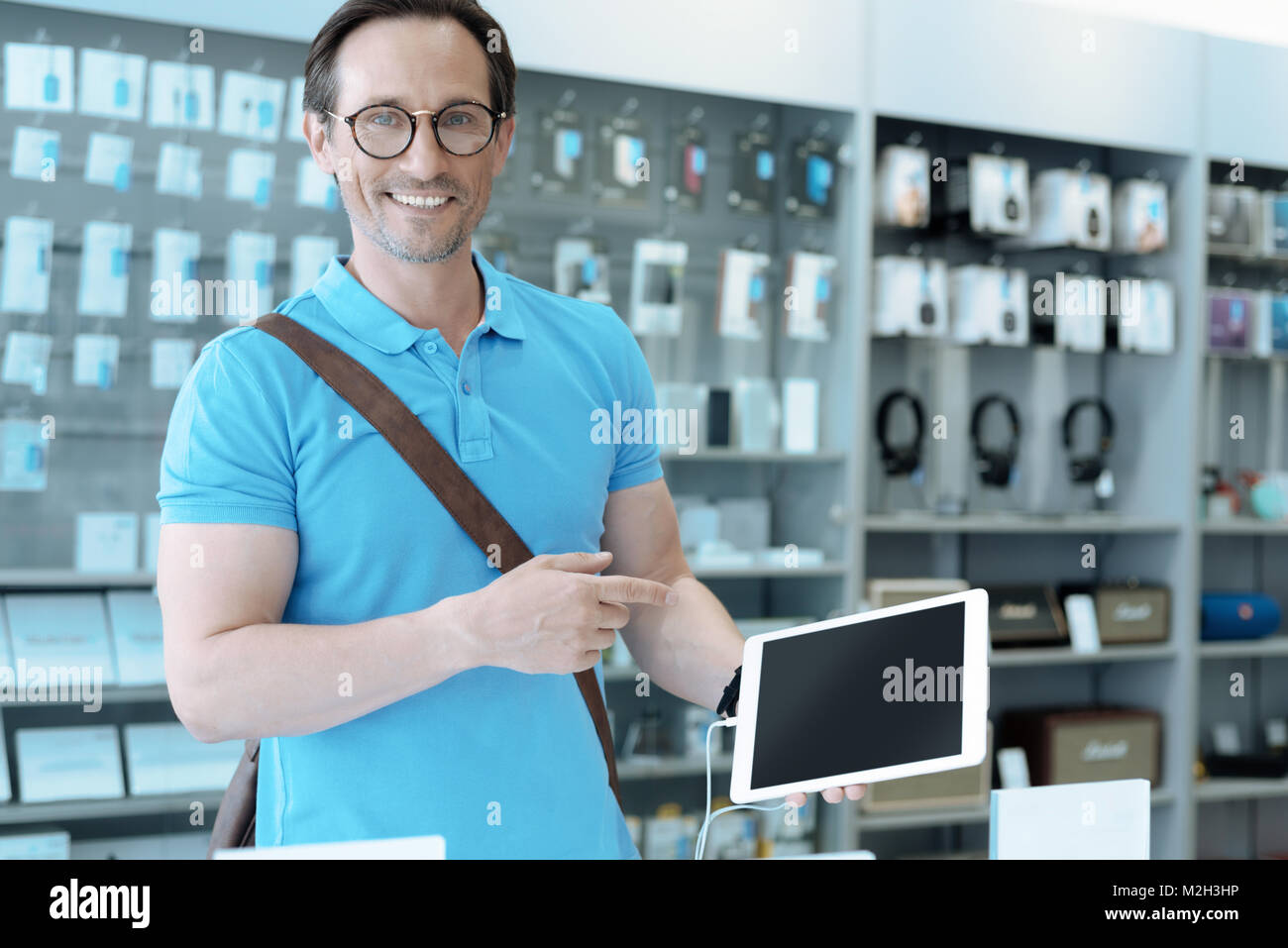 Positive clever man demonstrating his choice Stock Photo Alamy