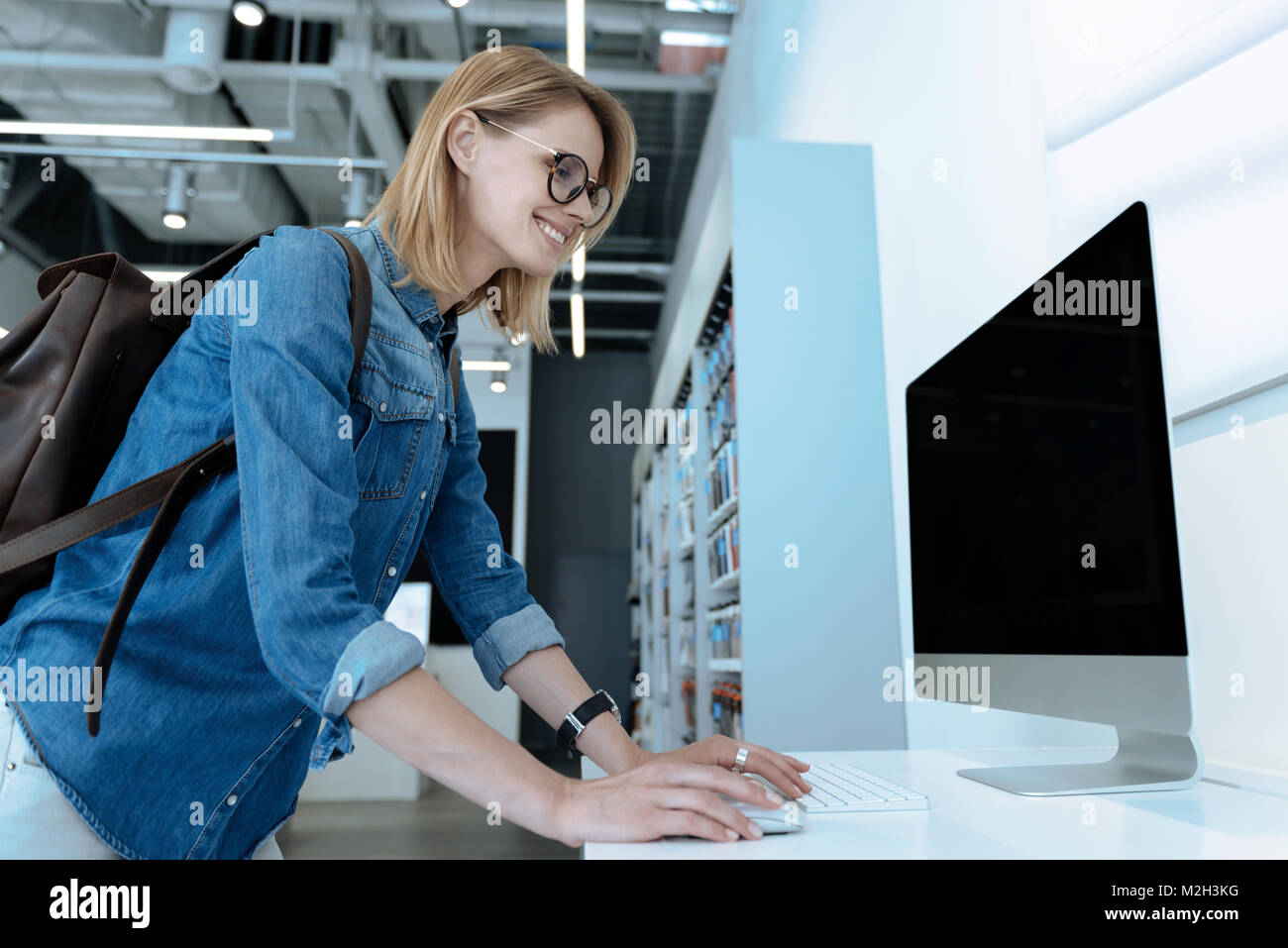 Blonde Computer Program Enigmatical blonde using modern computer Stock Photo - Alamy