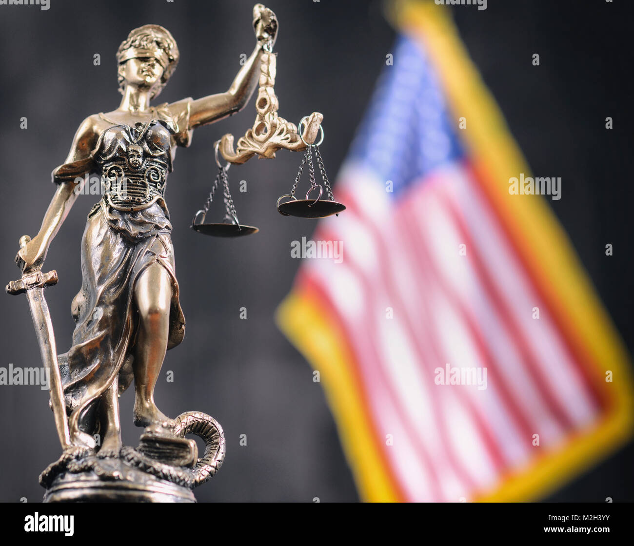 Law and Justice, Legality concept, Scales of Justice, Justitia, Lady Justice in front of the American flag in the background. Stock Photo