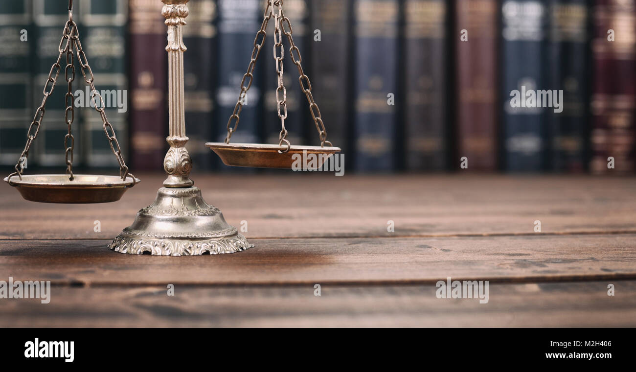 Law and Justice, Legality concept, Scales of Justice l on a wooden background, Law library concept. Stock Photo