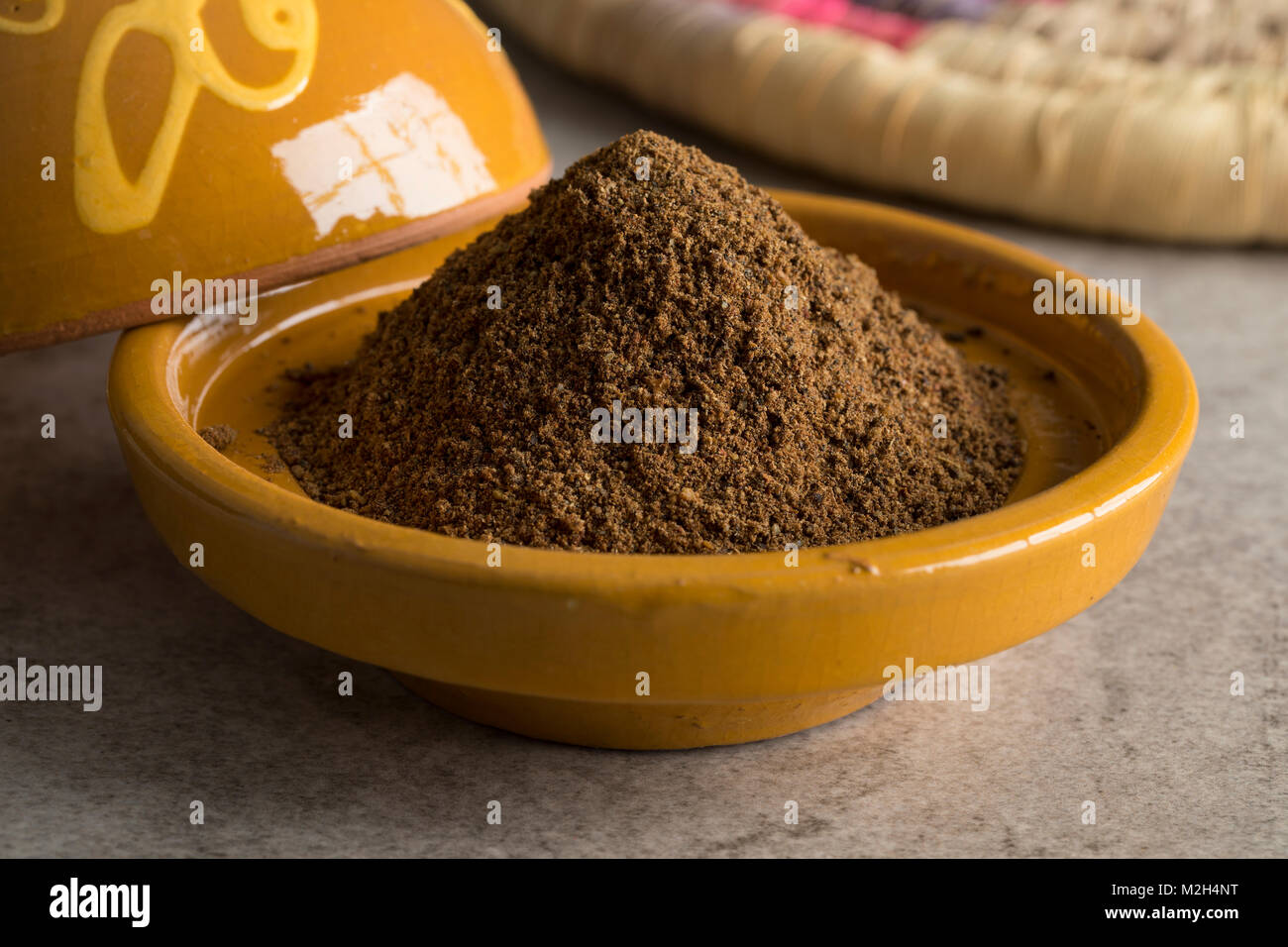 Traditional bowl with Moroccan Ras el Hanout herbs Stock Photo