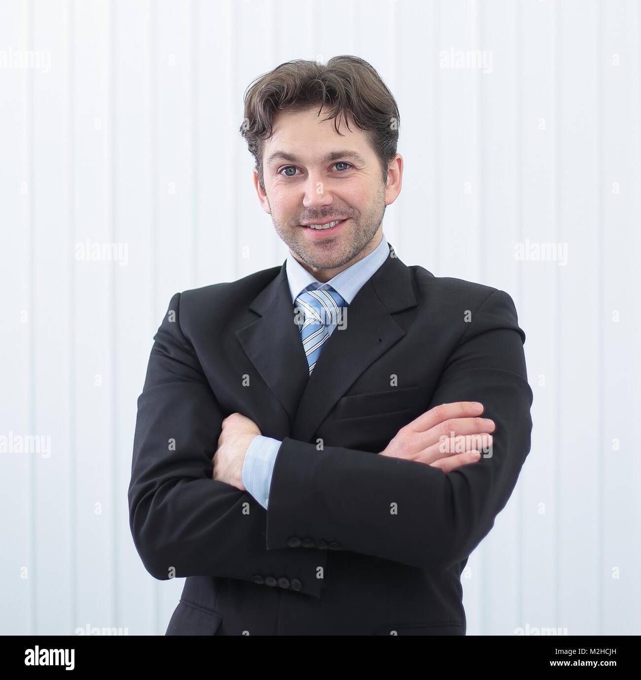 Portrait of happy smiling young businessman Stock Photo - Alamy