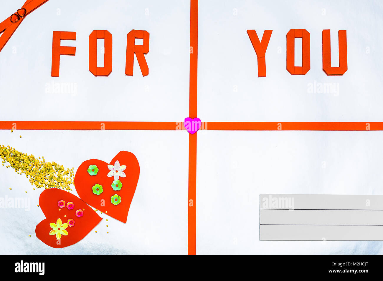 Greeting card 'For You' with hearts on colored background Stock Photo