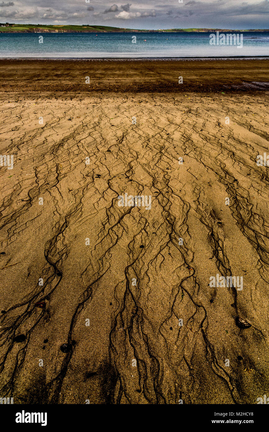 Water runoff patterns on a sandy beach at Clonakilty, Ireland Stock Photo
