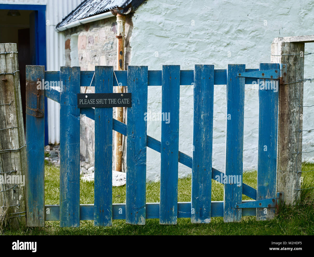 Painted wooden gate at Clachan Cottage. Shores of Loch Carron, Ardaneaskan Stock Photo