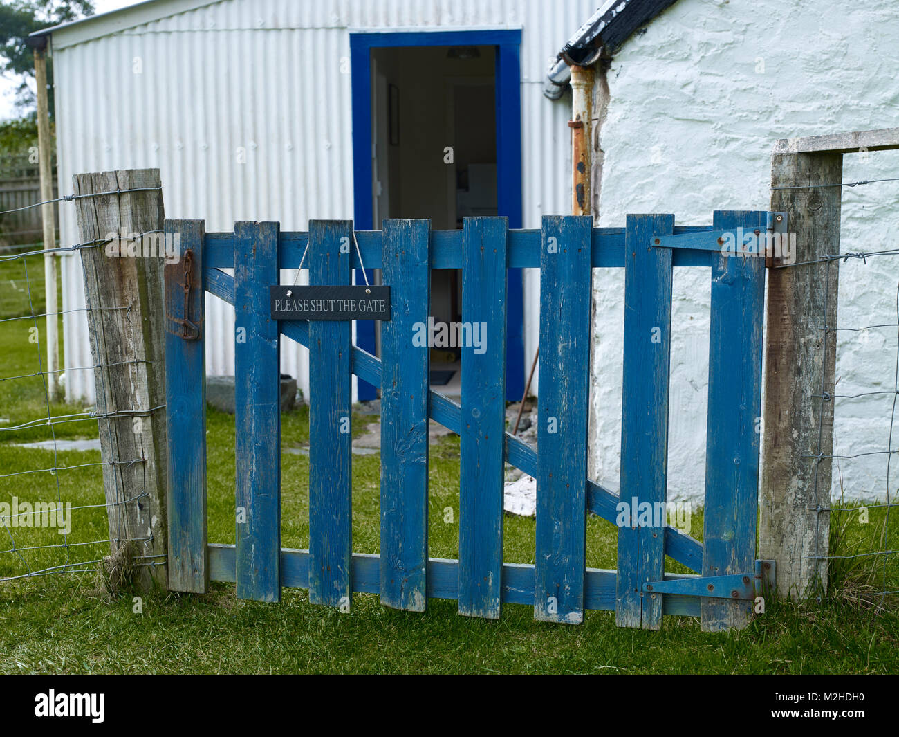 Painted wooden gate at Clachan Cottage. Shores of Loch Carron, Ardaneaskan Stock Photo