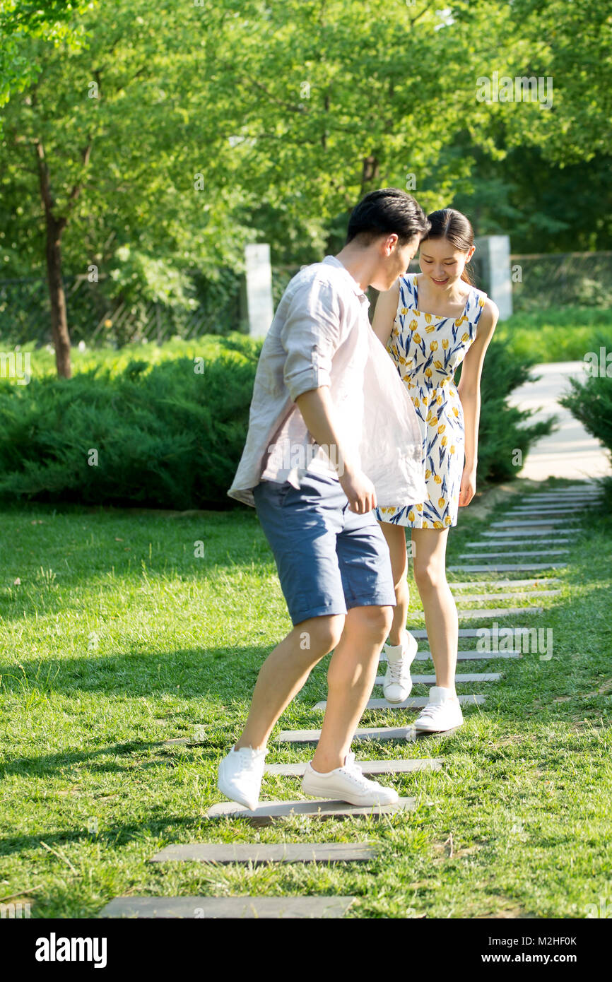Cheerful chinese couple walking hi-res stock photography and images - Alamy