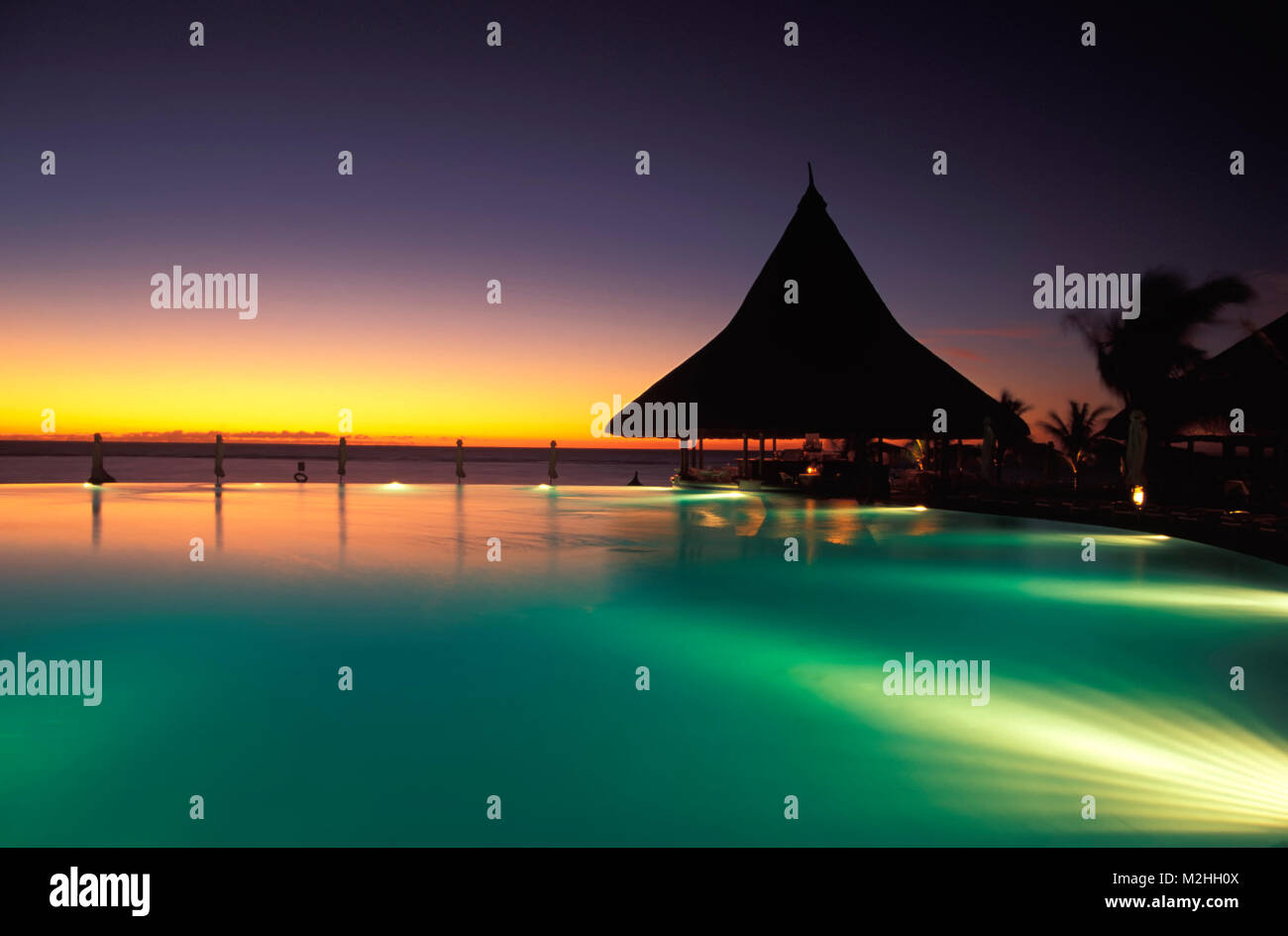 Hotel pool in the evening, MAURITIUS, Stock Photo