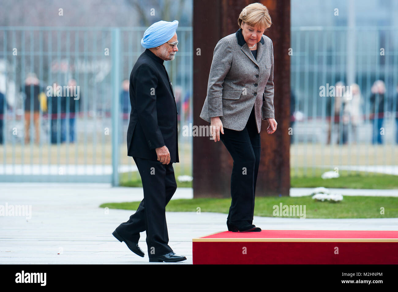 German Chancellor, Angela Merkel welcomes the Prime Minister of India, Manmohan Singh, with military honours at the Federal Chancellery. Stock Photo