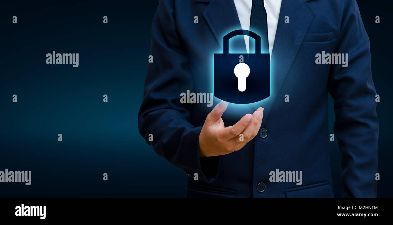lock In the hands of a businessman Shield the shield to protect the cyberspace.Space input data Data Security Business Internet Concept. Secure inform Stock Photo