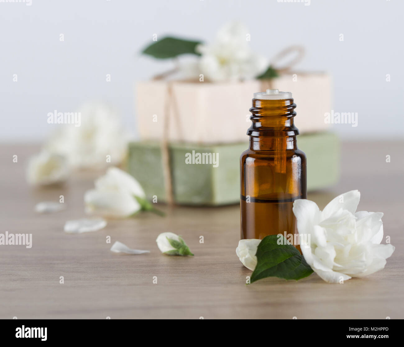 Jasmine essential oil and jasmine blossom, hanmade soap Stock Photo Alamy