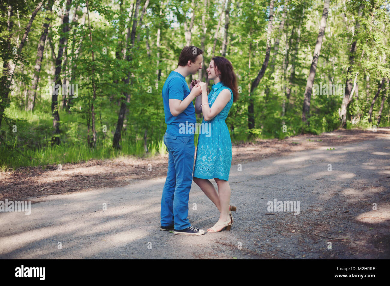 Young happy loving couple having fun and enjoying in park Stock Photo ...