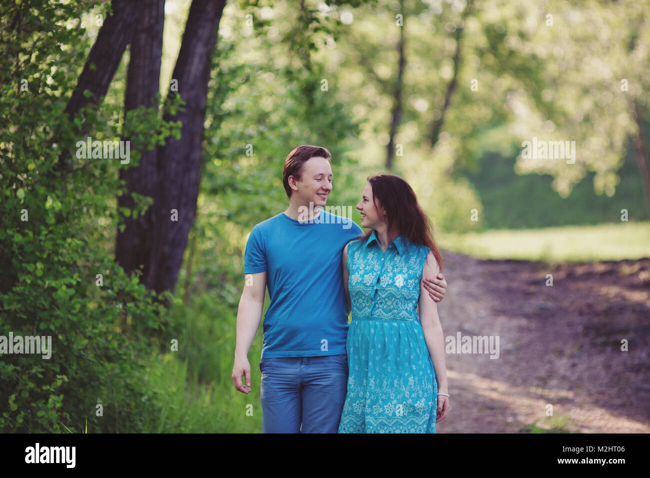 Young happy loving couple having fun and enjoying in park Stock Photo ...
