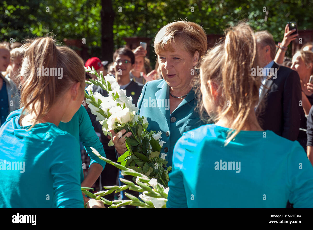 Federal Chancellor Angela Merkel visits Heinrich Schliemann secondary school in Berlin, and gives a History class  to the 12th graders on the 52nd Anniversary of the construction of Berlin Wall. Stock Photo