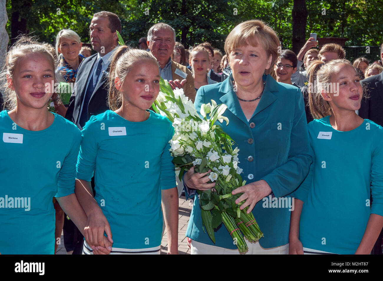 Federal Chancellor Angela Merkel visits Heinrich Schliemann secondary school in Berlin, and gives a History class  to the 12th graders on the 52nd Anniversary of the construction of Berlin Wall. Stock Photo