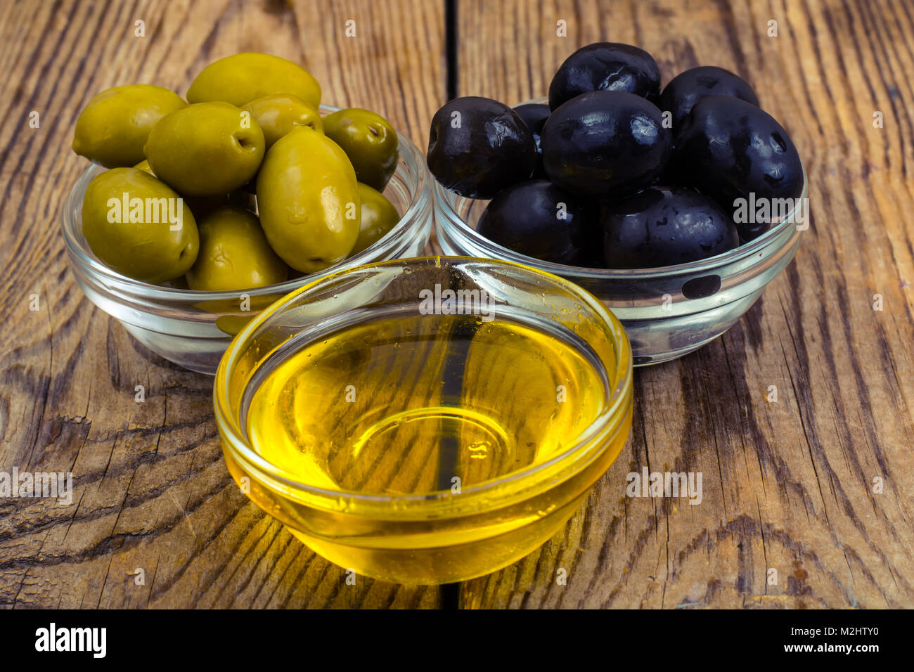 Olives with olive oil Stock Photo - Alamy