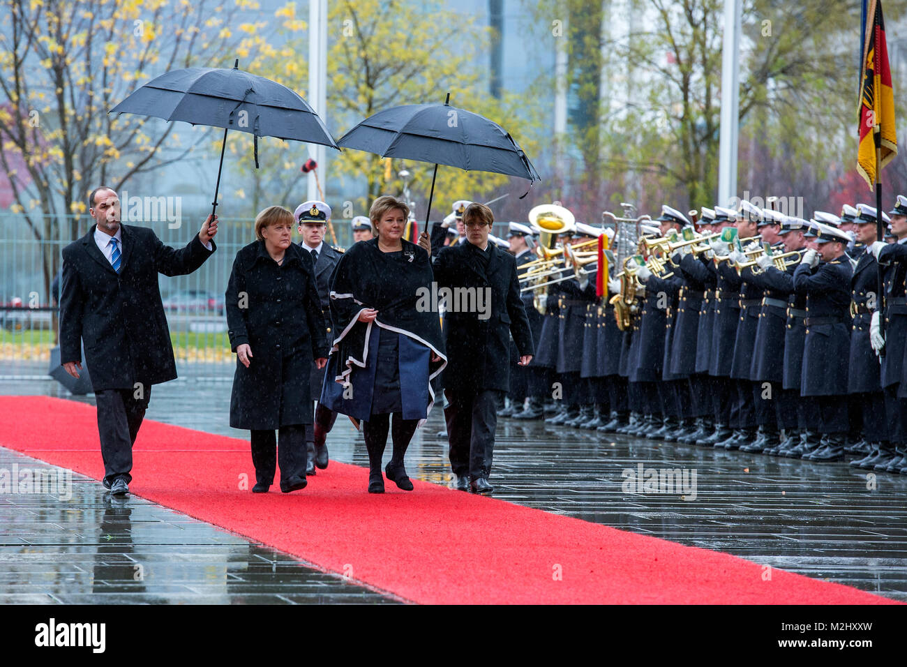 German Chancellor Angela Merkel give the welcomes to the Prime Minister of the Kingdom of Norway, Erna Solberg, with military honors in the Federal Chancellery. Stock Photo