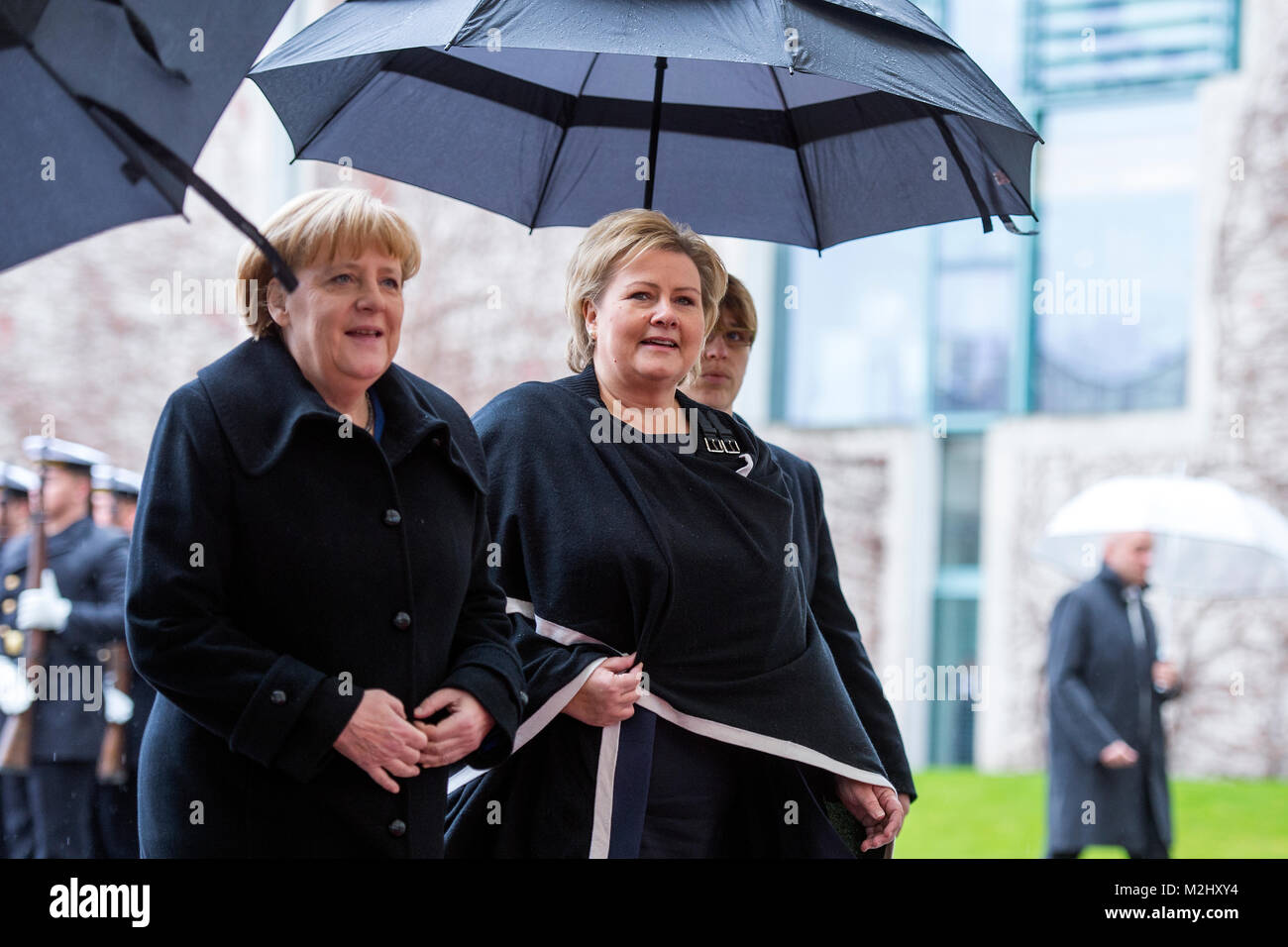 German Chancellor Angela Merkel give the welcomes to the Prime Minister of the Kingdom of Norway, Erna Solberg, with military honors in the Federal Chancellery. Stock Photo