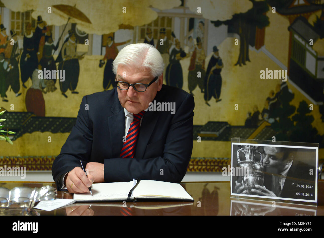 Federal Minister for Foreign Affairs Frank-Walter Steinmeier (SPD) signs the condolence book in memory of the Portuguese football player Eusébio (aka Black Panther) in the Portuguese Embassy in Berlin. Stock Photo