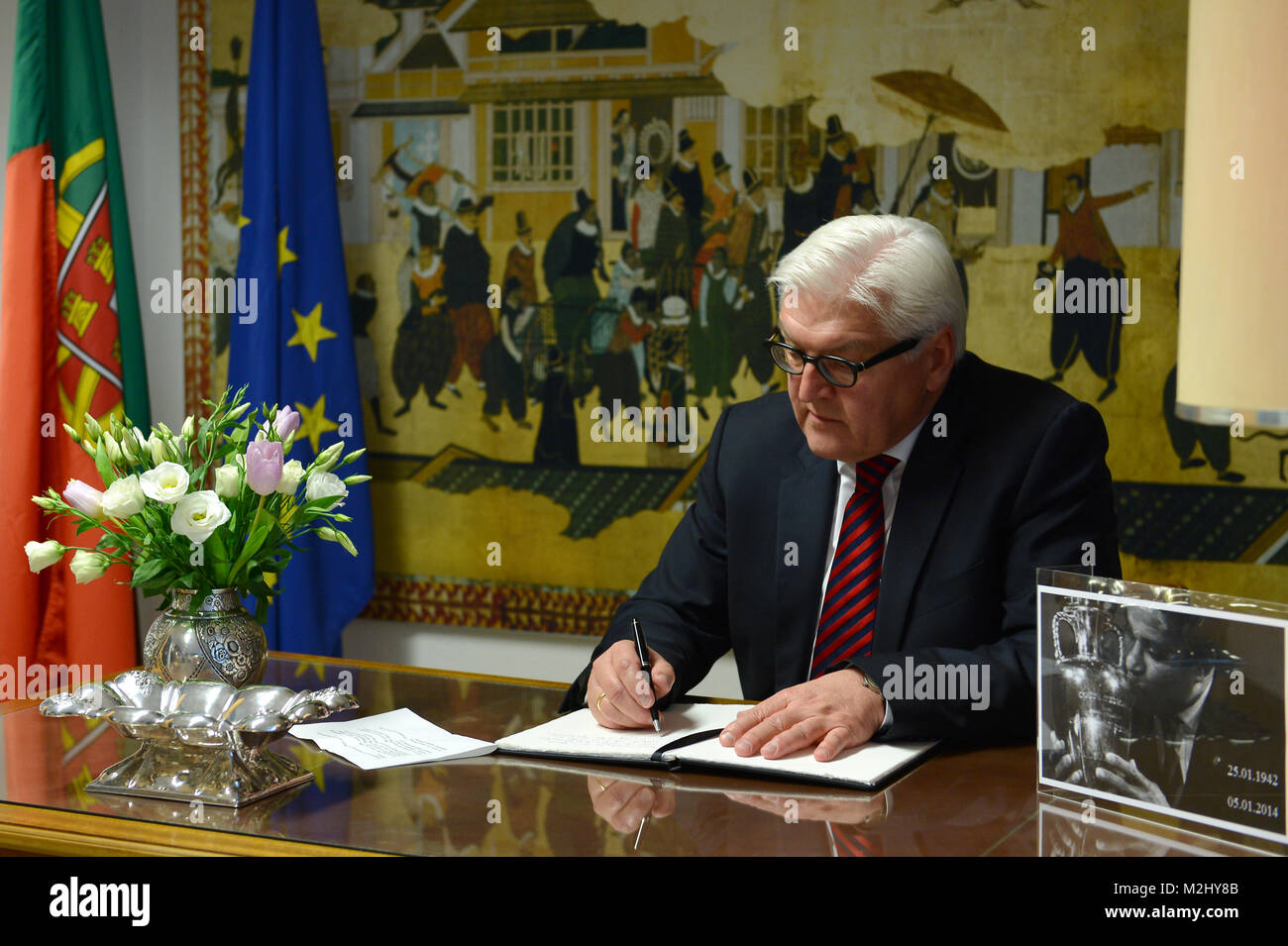 Federal Minister for Foreign Affairs Frank-Walter Steinmeier (SPD) signs the condolence book in memory of the Portuguese football player Eusébio (aka Black Panther) in the Portuguese Embassy in Berlin. Stock Photo