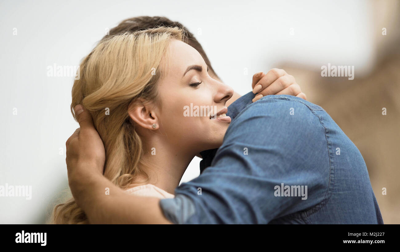 Girlfriend and boyfriend cuddling, showing strong romantic feelings ...