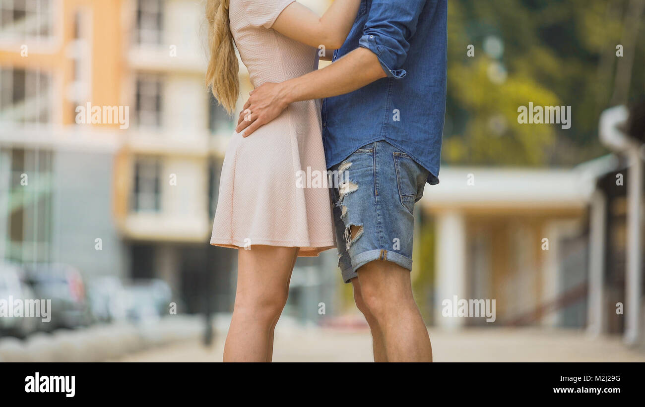 Free Photo | Portrait of young happy couple in love smiling and embracing  in garden sweet lovers wearing in stylish dark sunglasses and casual  clothes posing and looking at camera at daytime