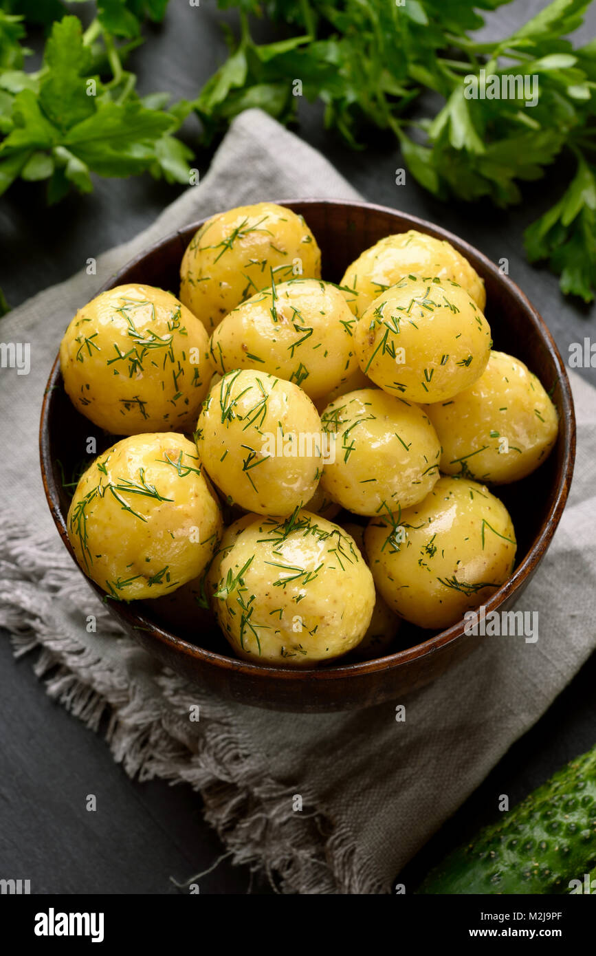 Diet natural food. New boiled potatoes with dill in bowl Stock Photo