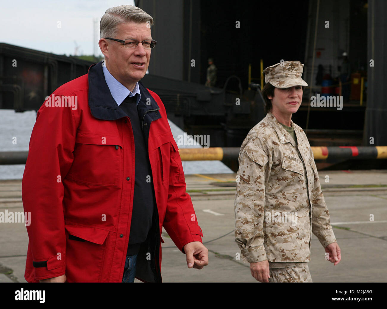 Latvian President Valdis Zatlers (left) walks with Maj. Gen. (sel.) Tracy L. Garrett, commanding general of the 4th Marine Logistics Group, prior to a distinguished visitor event at several sites around the exercise Baltic Operations 2010 training areas. Since the start the exercise on June 6th, the Marines and Sailors of 4th Landing Support Battalion and Naval Beach Group 2 have been working with members of the Armed Forces of Latvia to conduct maritime preposition force offload operations here. Latvian president walks with Marine major by EUCOM Stock Photo