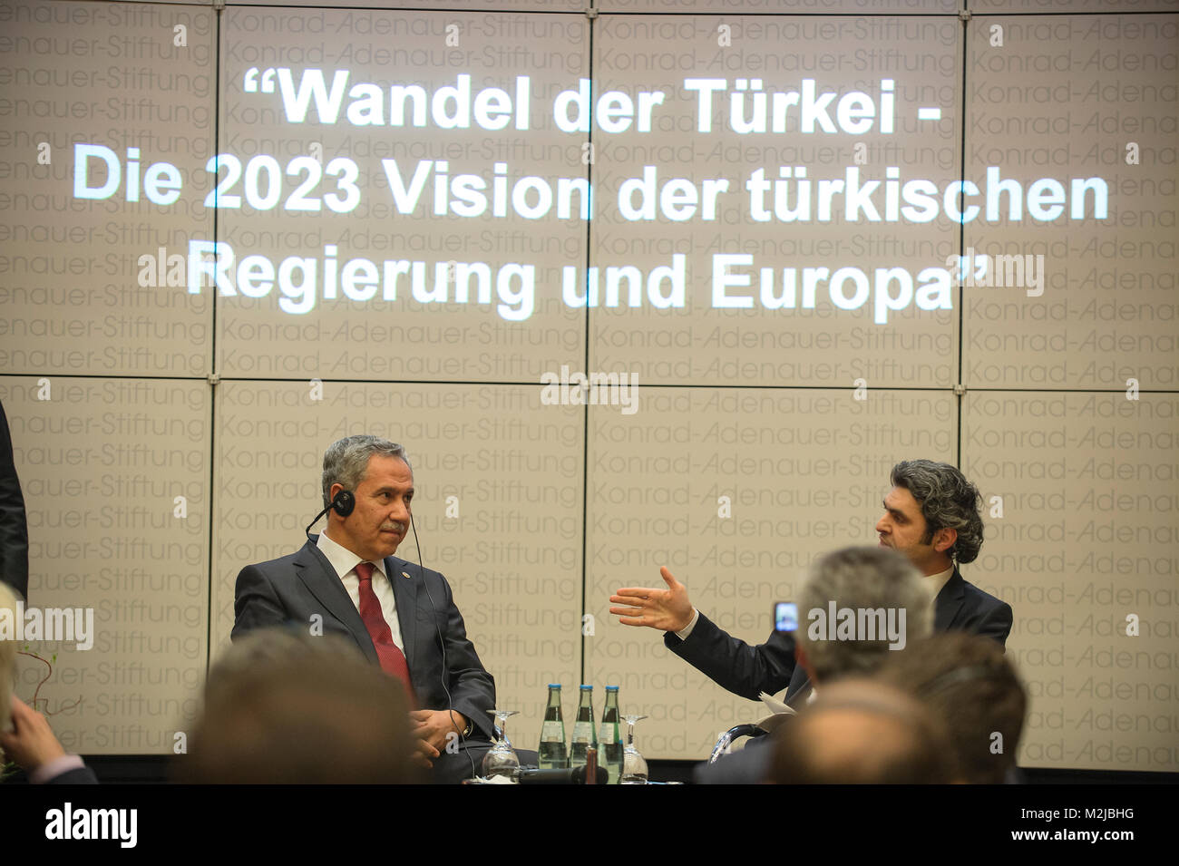 Deputy Prime Minister of Turkey Bülent Arinç gives a speech about the 2023 Vision of the Turkish Government and Europe. the session was stoped by some protesters from TGB (Turkish Youth Union) against the current policy of Turkey. Stock Photo