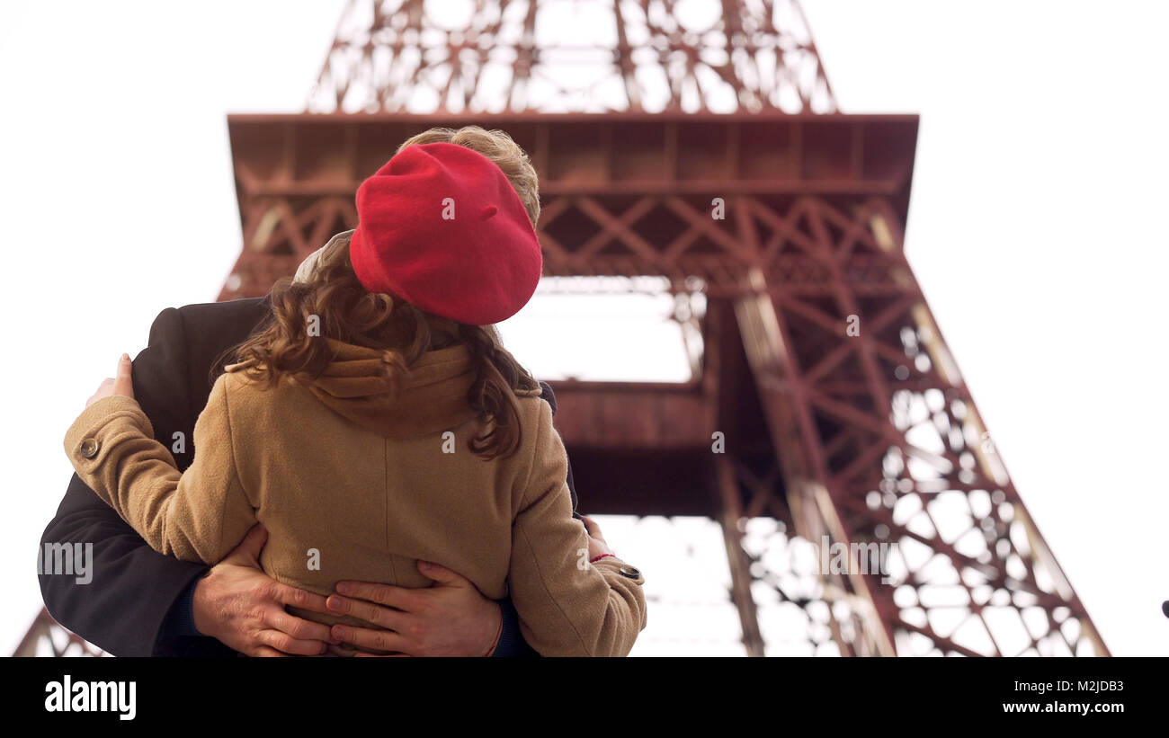Enamored man passionately kissing beloved woman on romantic date in Paris, stock footage Stock Photo