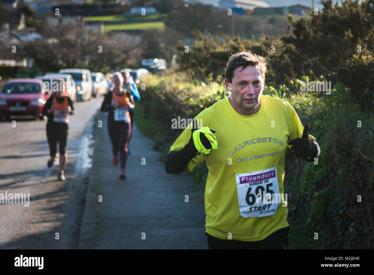 Runners competing in a road race in Newquay Cornwall. Stock Photo