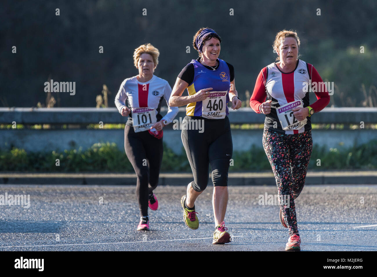 Mature runners competing in a road race in Newquay Cornwall. Stock Photo