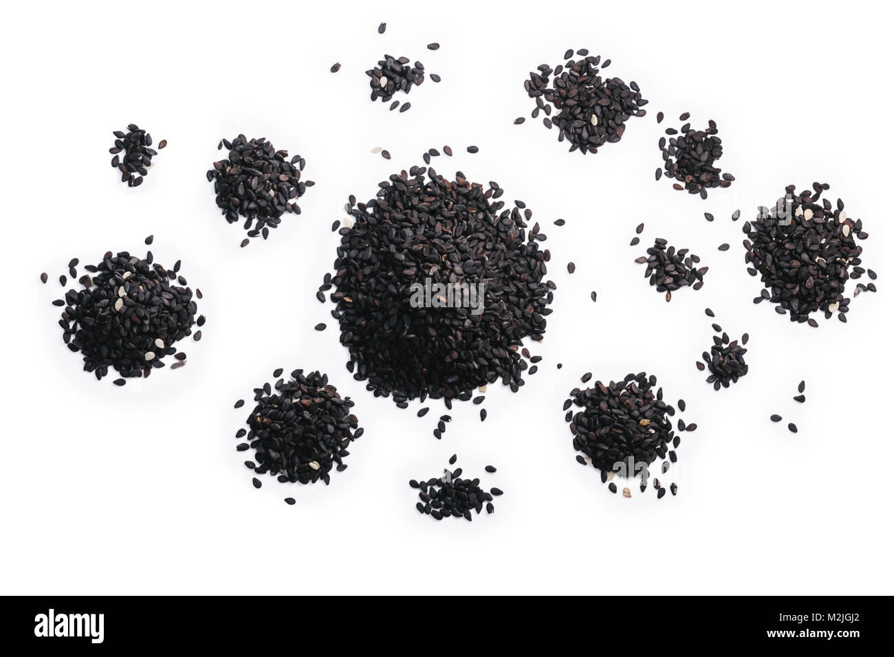 Black sesame seeds or benniseeds (Sesamum radiatum), piles. Clipping ...