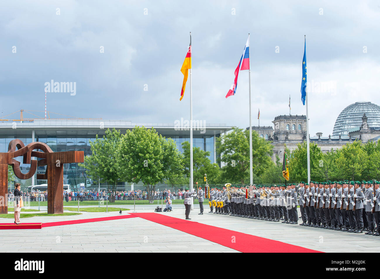 Federal Chancellor Angela Merkel receives the Prime Minister of the Republic of Slovenia, Alenka Bratušek with military honors in the German Chancellery. Stock Photo
