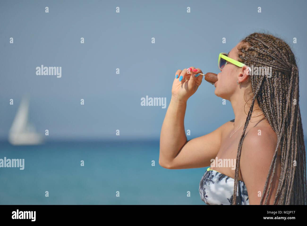 Girl Eating Ice cream Sea Ocean Stock Photo