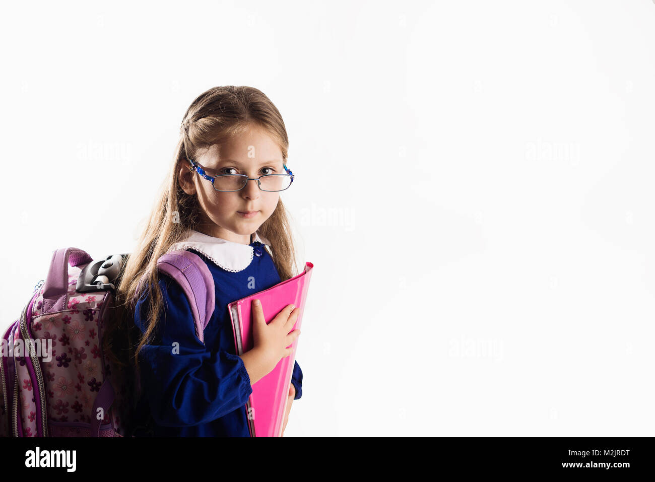 Caucasian elementary age schoolgirl with glasses Stock Photo