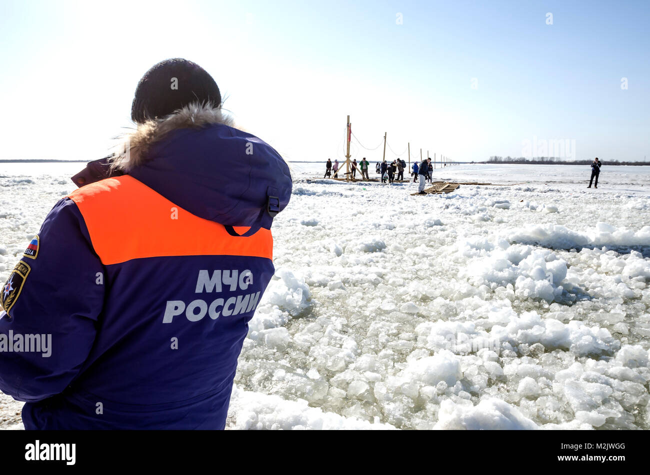 The rescuer monitors the ice crossing Stock Photo