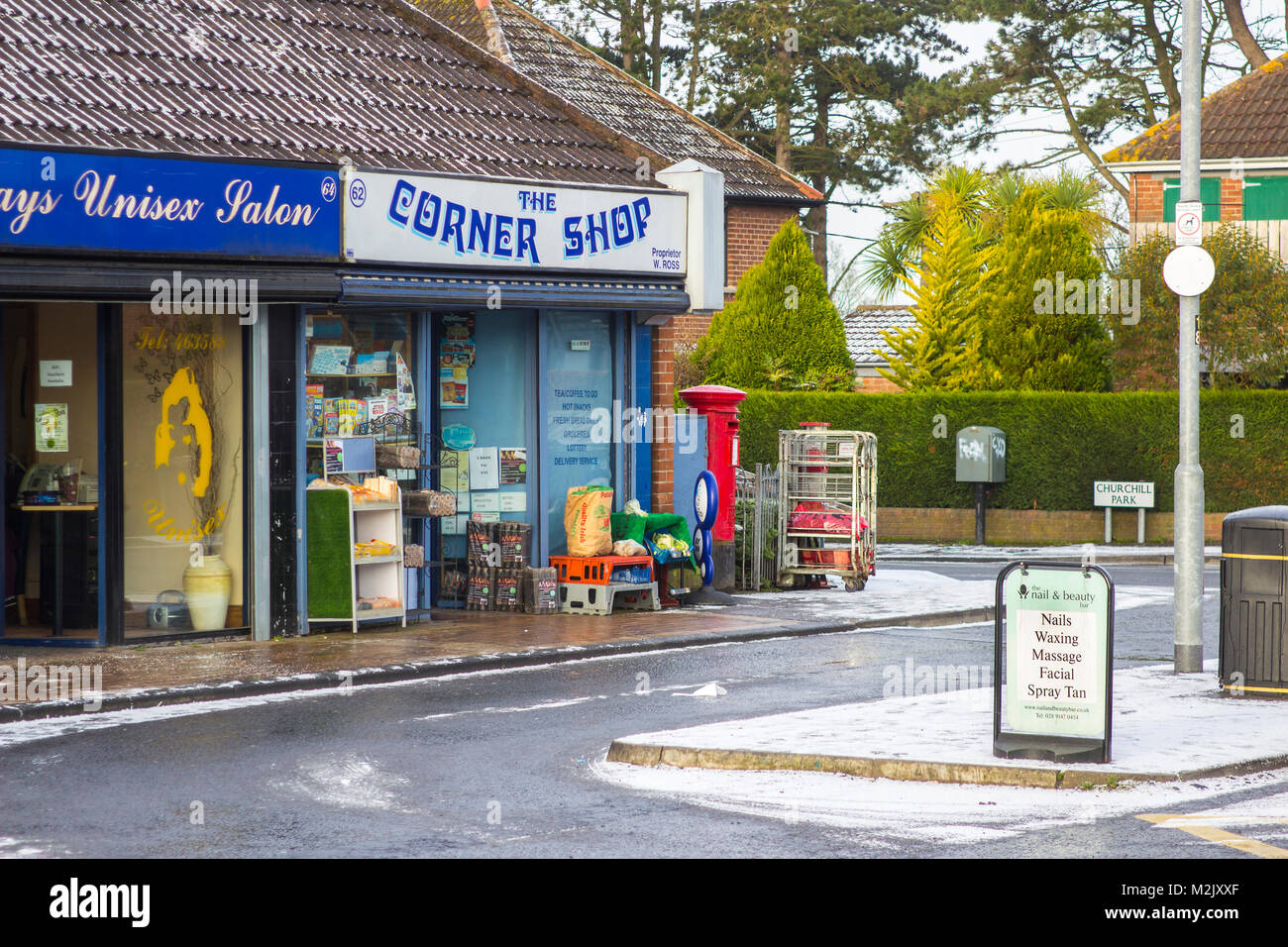7 February 2018 A typical corner shop and a local beauticians open for business on a bleak winter morning on the Ballymaconnell Road Bangor N Ireland Stock Photo