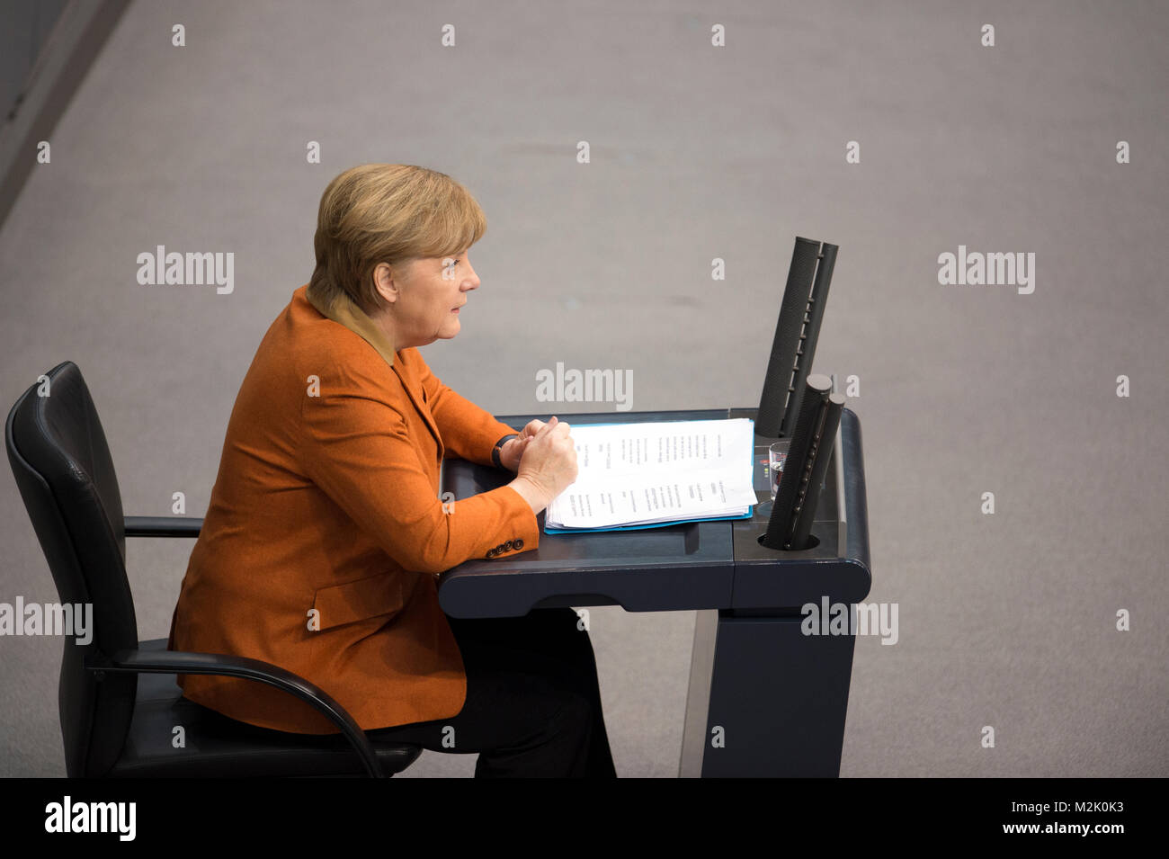 German Chancelor Angela Merkel gives a motivating speech in BundesTag about the German Economy polecy. Stock Photo