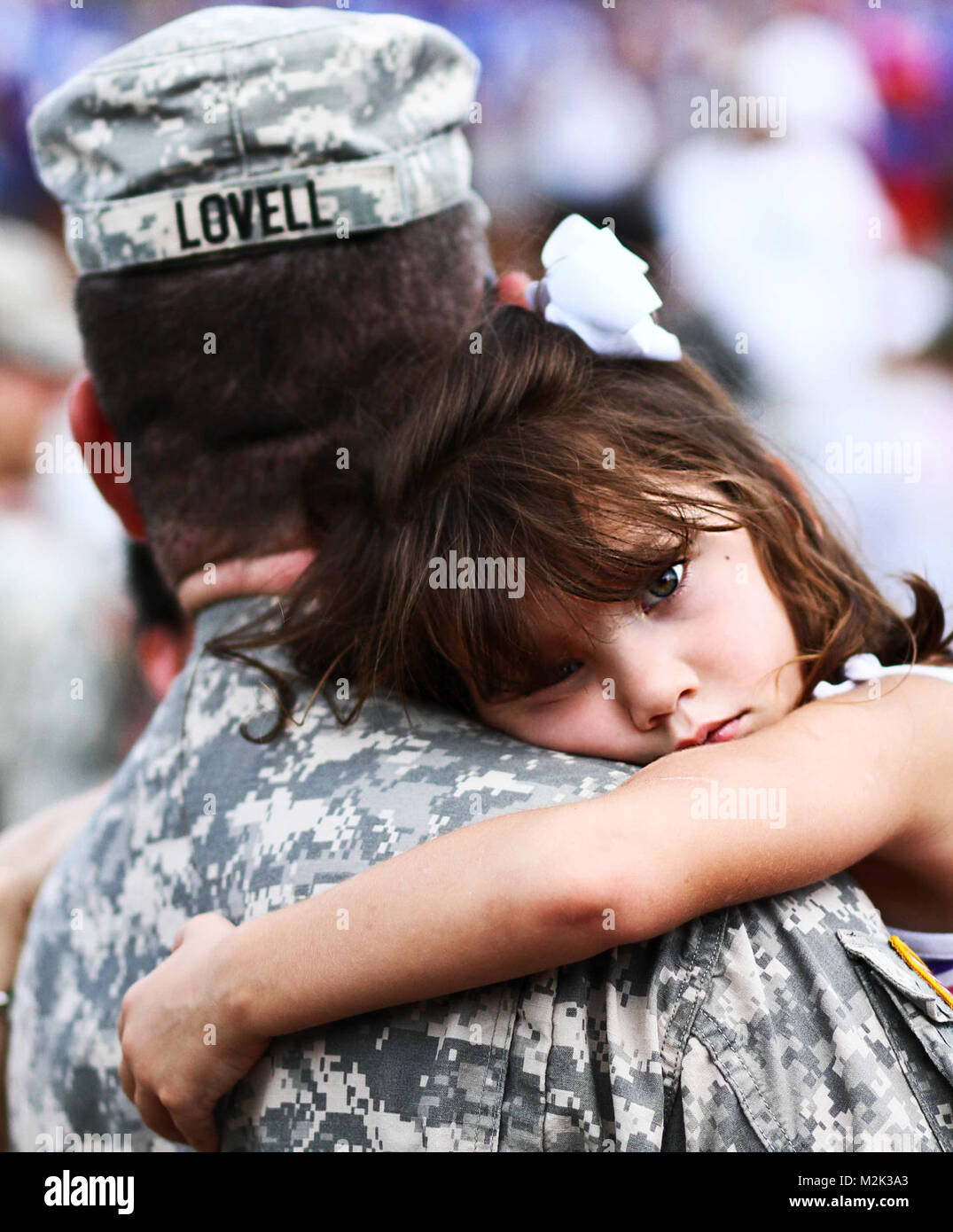 Fiveyearold Maddie Lovell of Cardington, Ohio, clings to her father