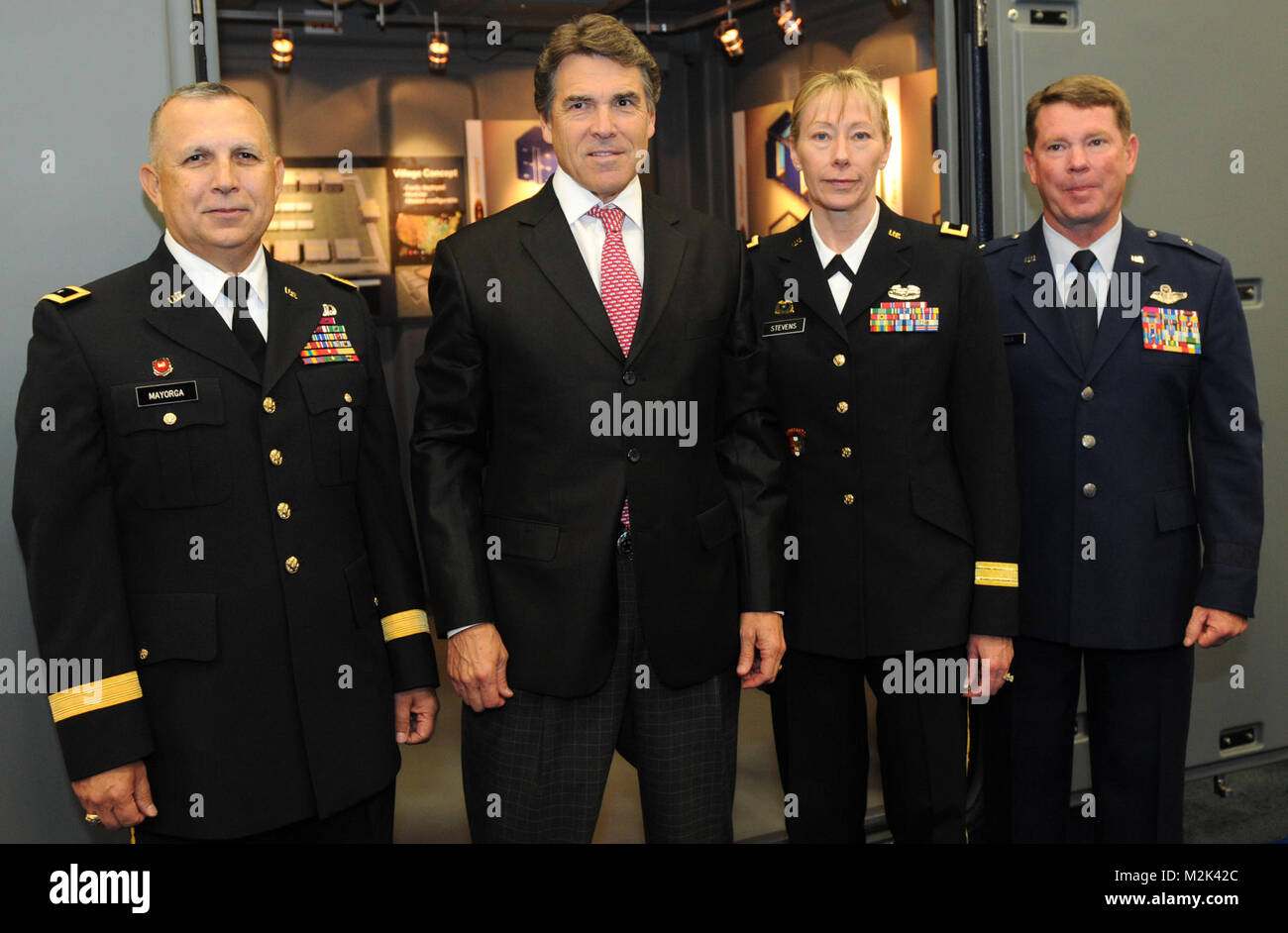 From left to right: Army Maj. Gen Jose S. Mayorga, Army Brig. Gen. Joyce L. Stevens and Air Force Brig. Gen. John F. Nichols join Texas Gov. Rick Perry Aug. 21 at the 132nd National Guard Association of the United States General Conference in Austin, Texas. 100821-A-1403C-007 by Texas Military Department Stock Photo