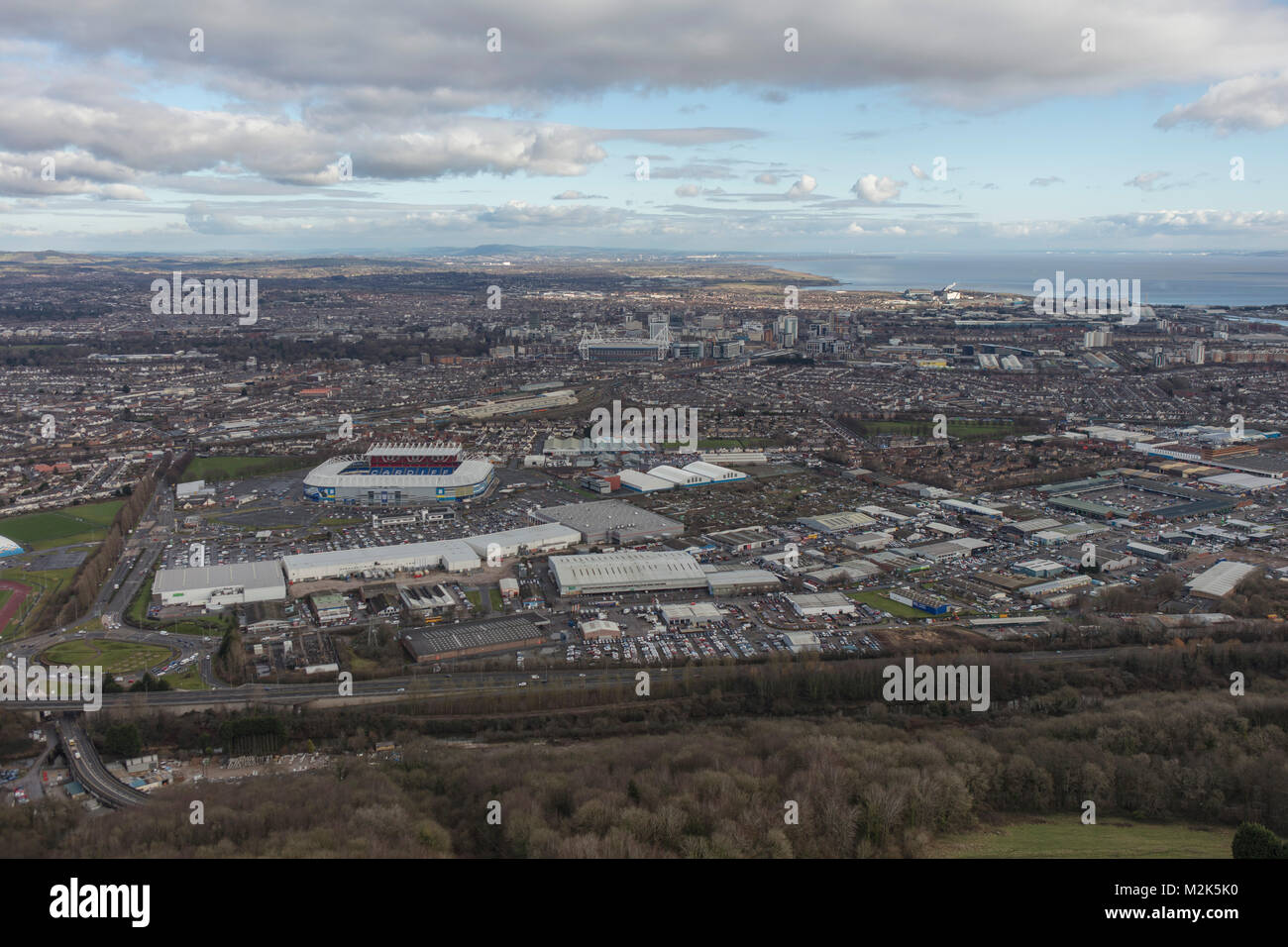 An aerial view of the skyline of the Welsh Capital Cardiff with the Bristol Channel visible beyond Stock Photo
