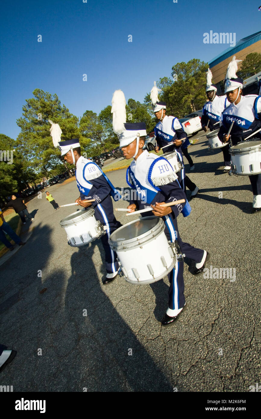Members of the Hampton University marching band march to Armstrong