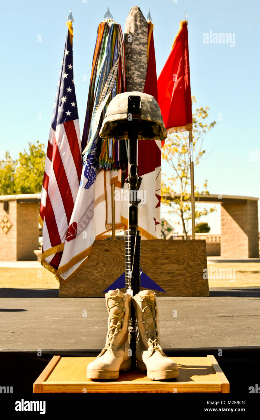 FORT HOOD, Texas -- An upturned rifle with helmet and boots symbolizes the  fallen Soldiers at the memorial ceremony on Nov. 5, 2010. Thrteen poeple  were killed and 31 were wounded in