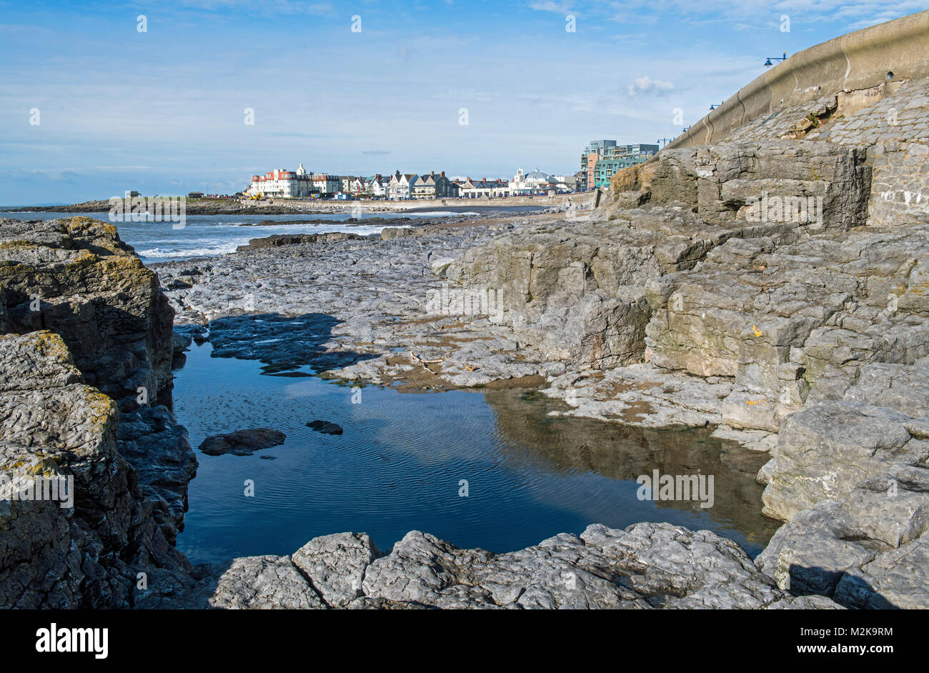 Porthcawl seen from the beach between the rocks on the south Wales Coast Stock Photo