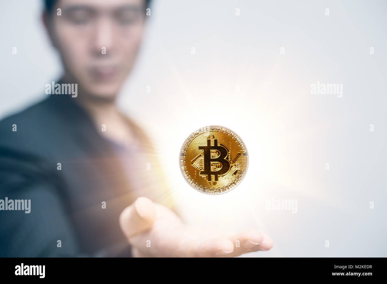 Asian business man open palm with Bitcoin in Hand Stock Photo - Alamy