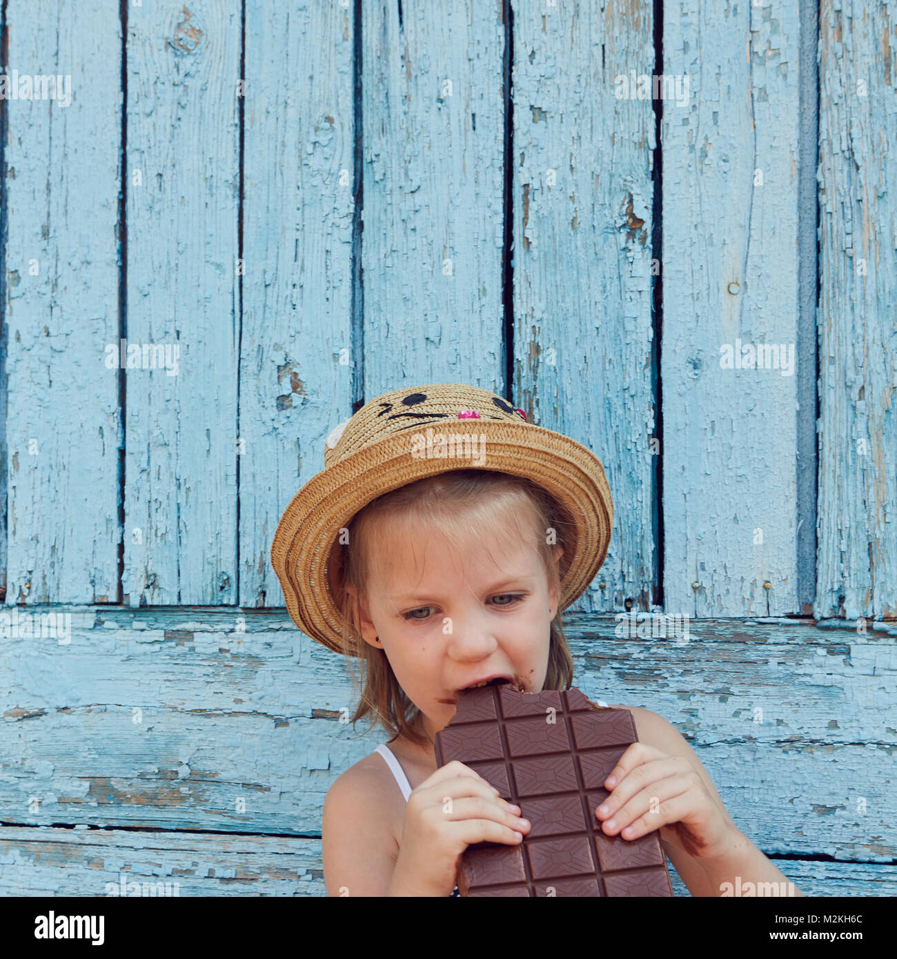 Girls eat chocolate Stock Photo Alamy